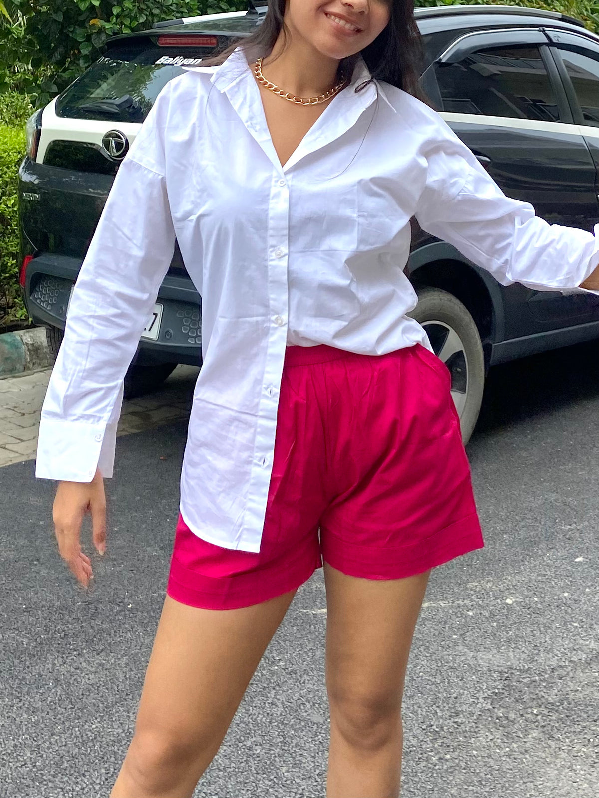 Oversized white shirt with pink shorts