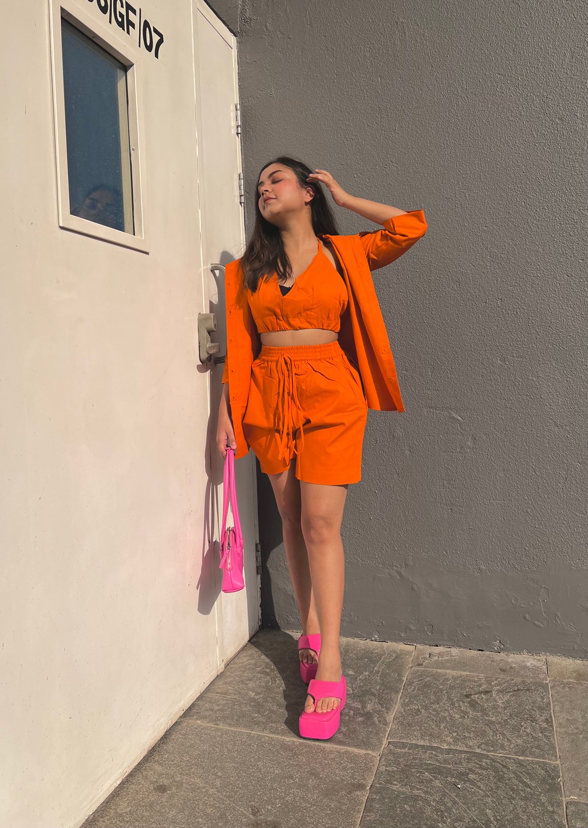 A hot orange co-ord set, the perfect outfit to make a bold fashion statement.